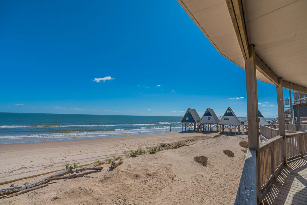 warm beach with A frame houses for a winter beach vacation