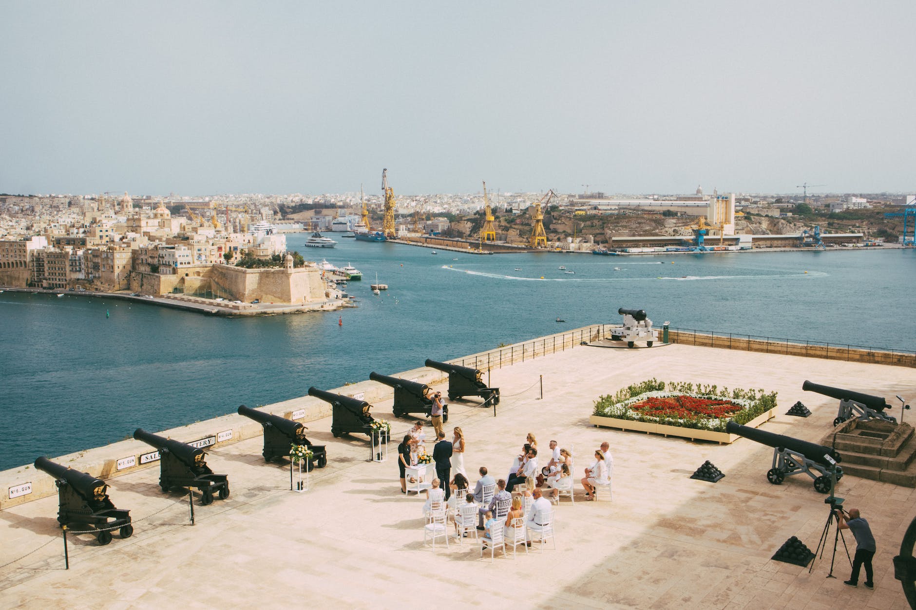 view of small wedding ceremony by saluting battery in valetta malta