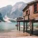 wooden house on pillars at mountain lake
