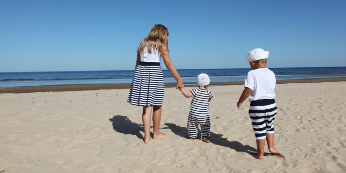 child wearing white crew neck shirt